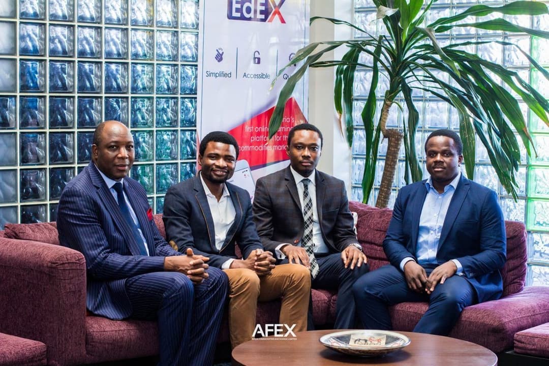 akinyinka_sitting_with_three_men_introducing_Ed_EX.jpeg