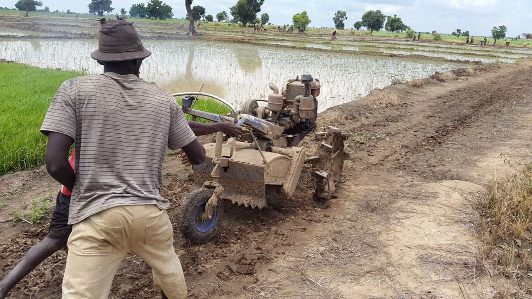 farmers_pushing_a_plough_machine.jpg
